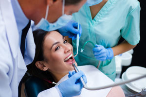 teeth cleaning pearland tx, woman in dentist chair