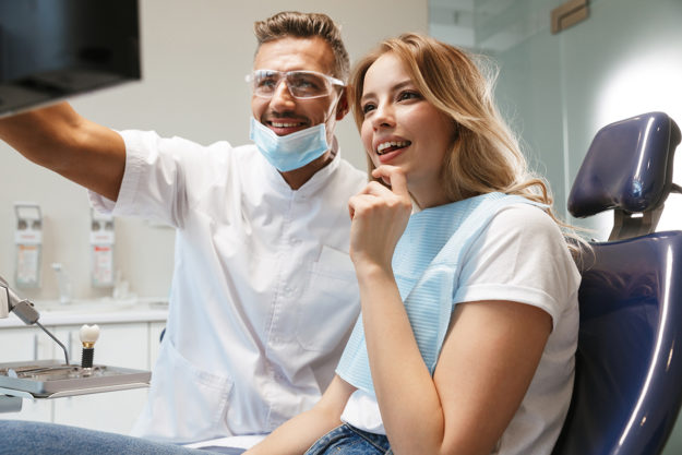 treating a chipped tooth (6) patient seeing how dentist is Treating a Chipped Tooth