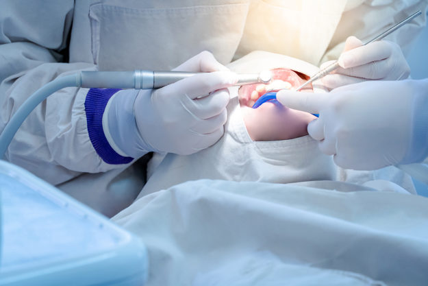 what is a dental emergency (6) dentist operating showing What is a Dental Emergency