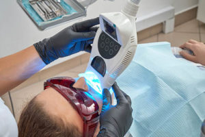 a person receives teeth whitening treatments