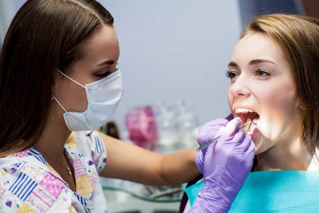 1-3-Benefits-of-Adult-Orthodontic-Services (1) woman receiving adult orthodontics