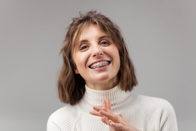 5 Signs You Need Dental Braces Again woman needs dental braces